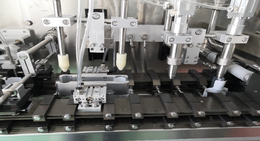 Dispozitiv special personalizat de deschidere și suflare a sacului, umplere cu două capuri更有效开袋吹气装置、双头灌装